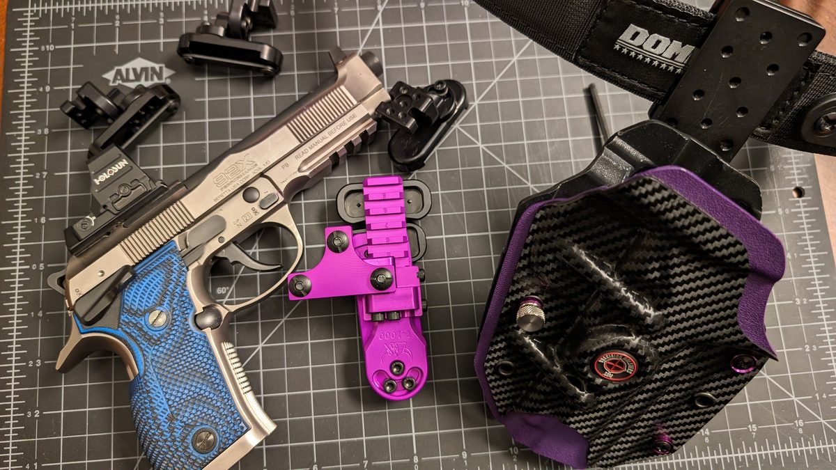 Handgun and safety gear laid out for a firearms safety course
